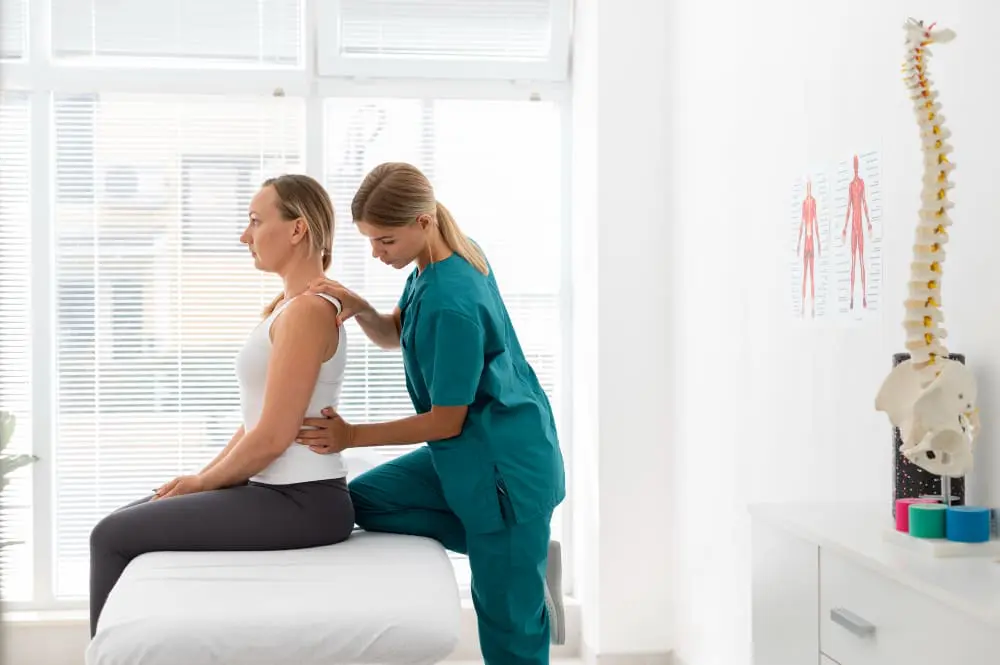 Physiotherapist Helping Patient with Back Problems